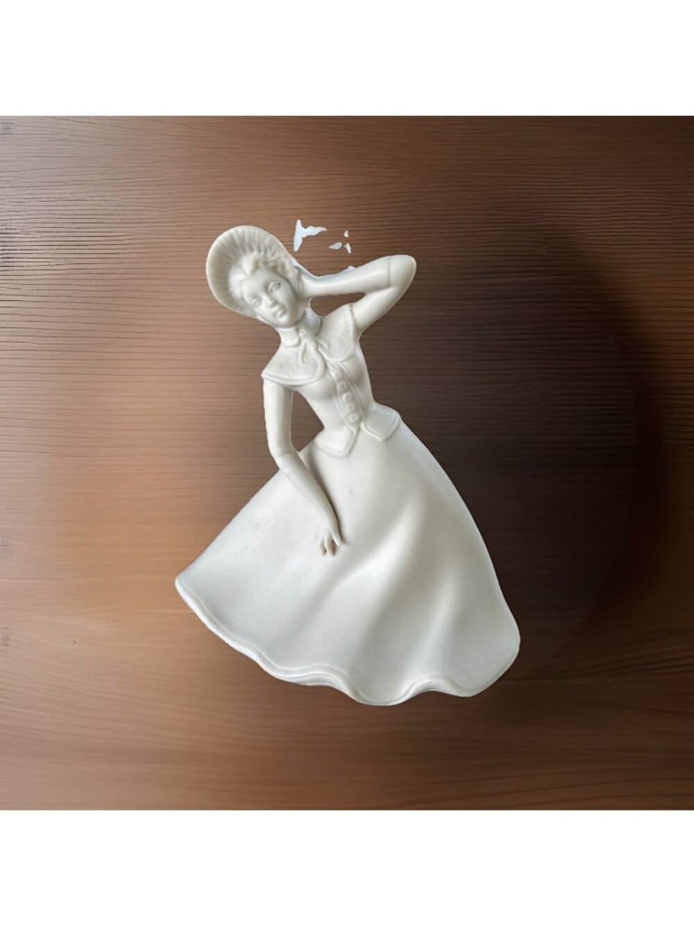 Vintage  porcelain figurine of a lady, likely from the Art Deco period